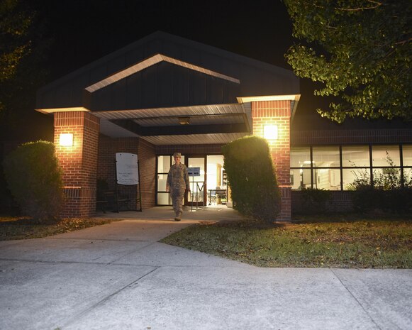 An Airman exits the Emergency Family Assistance Center Oct. 13. The EFAC is open for 24 hour financial assistance at the Airman and Family Readiness Center on Joint Base Charleston, South Carolina, from Oct. 12 until Oct. 18. The EFAC was activated in response from the Hurricane Matthew base evacuation.