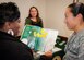 Senior Airman Christina Faro, 96th Aerospace Medicine Squadron, receives information from Donna Shoebrook, Saint Leo University staff coordinator, at the Education Center open house Oct. 13 at Eglin Air Force Base, Fla.  Four universities and one college were presented to promote awareness of the opportunities to pursue higher education on the base.  (U.S. Air Force photo/Kevin Gaddie)   