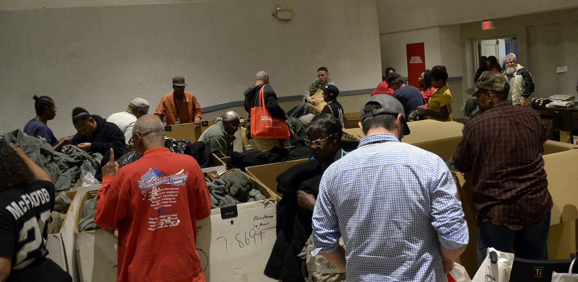 Volunteers from the 445th Airlift Wing bag and hand out donated items at the Dayton Veterans Affairs Medical Center Homeless Vets Stand down event Sept. 30, 2016. The annual event provides a meal, clothing, health screenings, VA and Social Security benefits counseling, and referrals to a variety of other necessary services, such as: housing, employment, substance abuse and mental health treatment services to more than 300 veterans. (U.S. Air Force photo/Staff Sgt. Joel McCullough)