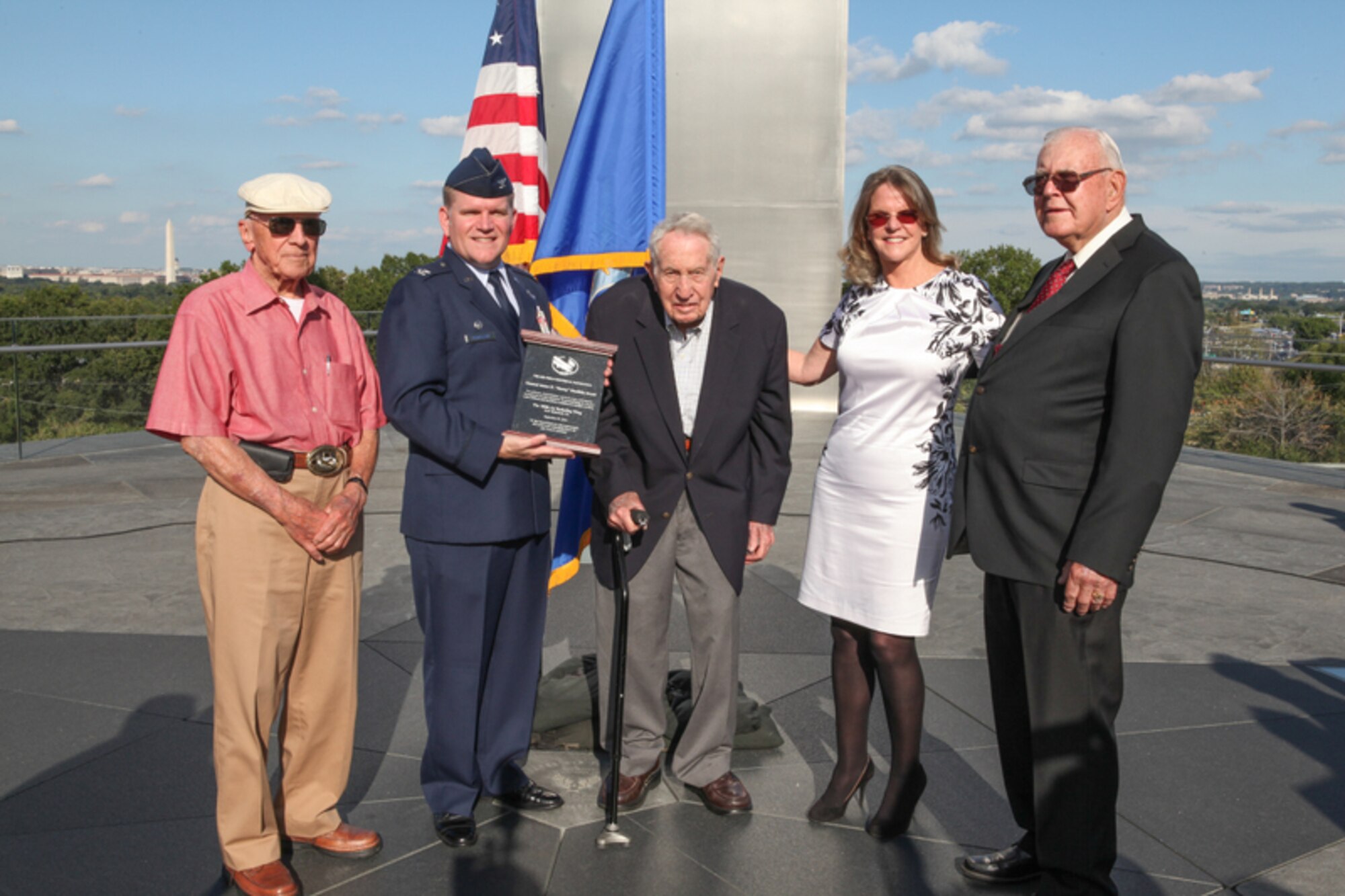 U.S. Air Force Col. Thomas Torkelson, second from the left, 100th Air Refueling Wing commander, holds the Air Force Historical Foundation’s Doolittle Award, presented to the 100th ARW Sept. 27, 2016, as he poses for a photo with Jonna Doolittle Hoppes, second from the right, granddaughter of Gen. James Harold “Jimmy” Doolittle, and 100th Bomb Group veterans at Arlington, Va. The award was named after Doolittle Hoppes’ grandfather, a pioneering pilot whose career stretched from World War I to the height of the Cold War. It was presented in recognition of the 100th ARW’s sustained and significant contributions to Air Force history. (Courtesy photo) 