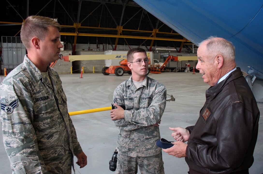 Col. Randall Lanning (right), Mascoutah High School Junior ROTC instructor, brought his students out to visit and created a video for their school project.  When he noticed a problem being solved, he stepped forward to thank Senior Airman Adam Broeckling and Senior Airman Landon Wineland, members of the 932nd Maintenance Group, who were able to swap out a problematic generator at the last minute, and provide electric power and lights during a special event with the JROTC cadet group that the wing adopted.  (U.S. Air Force photo by Lt. Col. Stan Paregien)