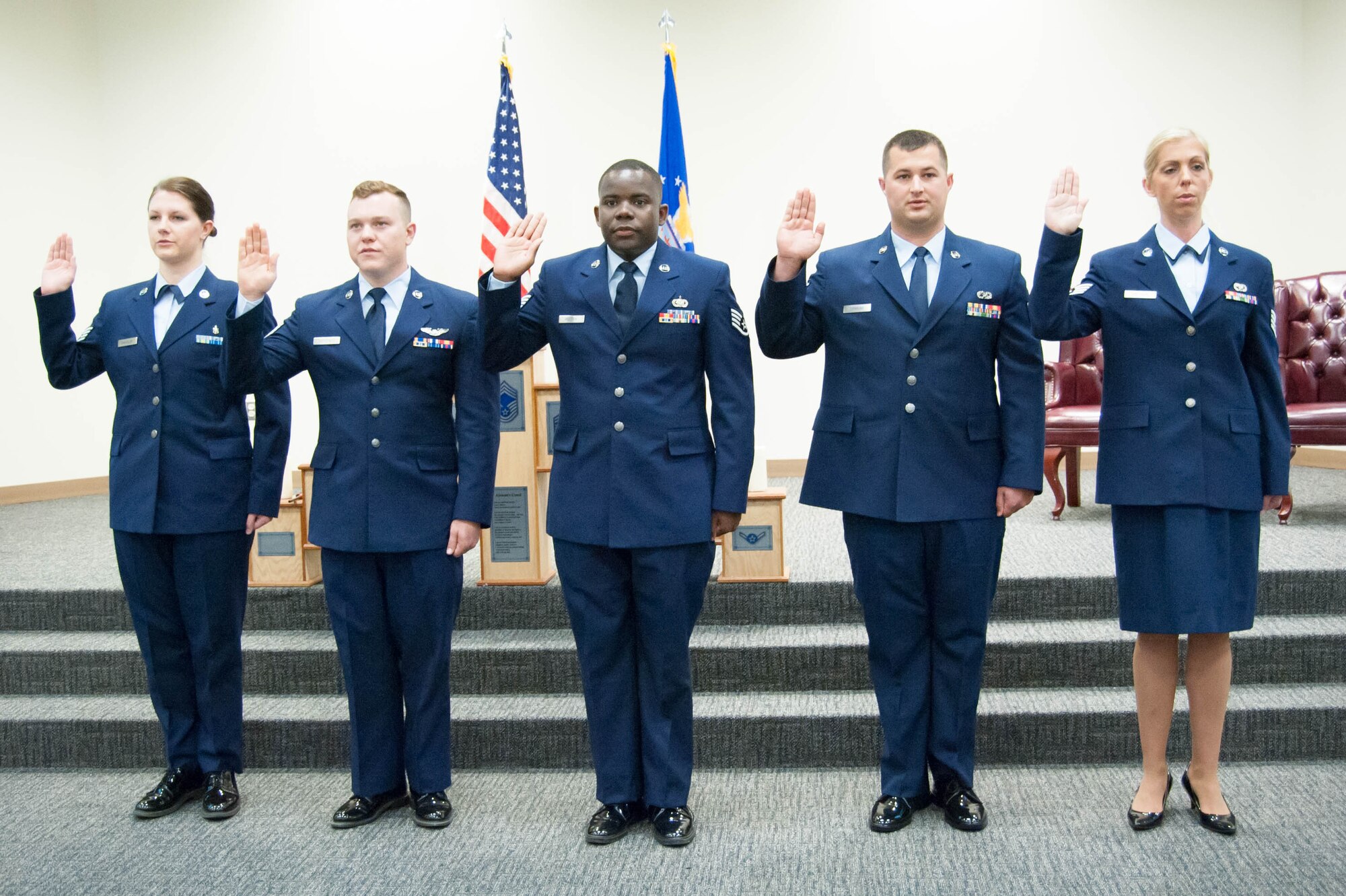 The 403rd Wing's newest staff sergeants swear the noncomissioned officer oath of induction during a ceremony at the Roberts Consolidated Aircraft Maintenance facility Oct. 16. (U.S. Air Force photo/Senior Airman Heather Heiney)