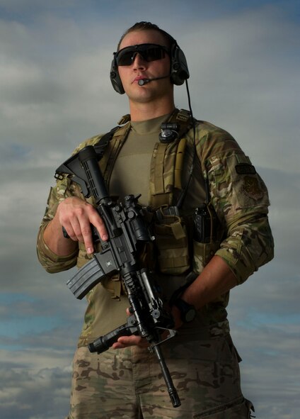 Staff Sgt. Jordan Douglas, 791st Missile Security Forces Squadron tactical response force member, stands guard of a UH-1N Iroquois helicopter at Minot Air Force Base, N.D., Aug. 25, 2016. TRF members provide security for over 8,500 square miles within the missile complex. (U.S. Air Force photo/Senior Airman Apryl Hall)