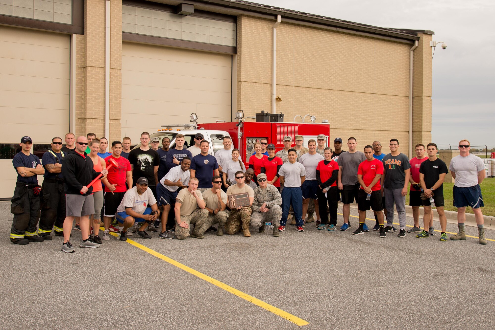 Participants of the 2016 Fire Muster competition pose for a group photo Oct. 13, 2016, on Dover Air Force Base, Del. The muster is held annually during Fire Prevention Week. (U.S. Air Force photo by Mauricio Campino)