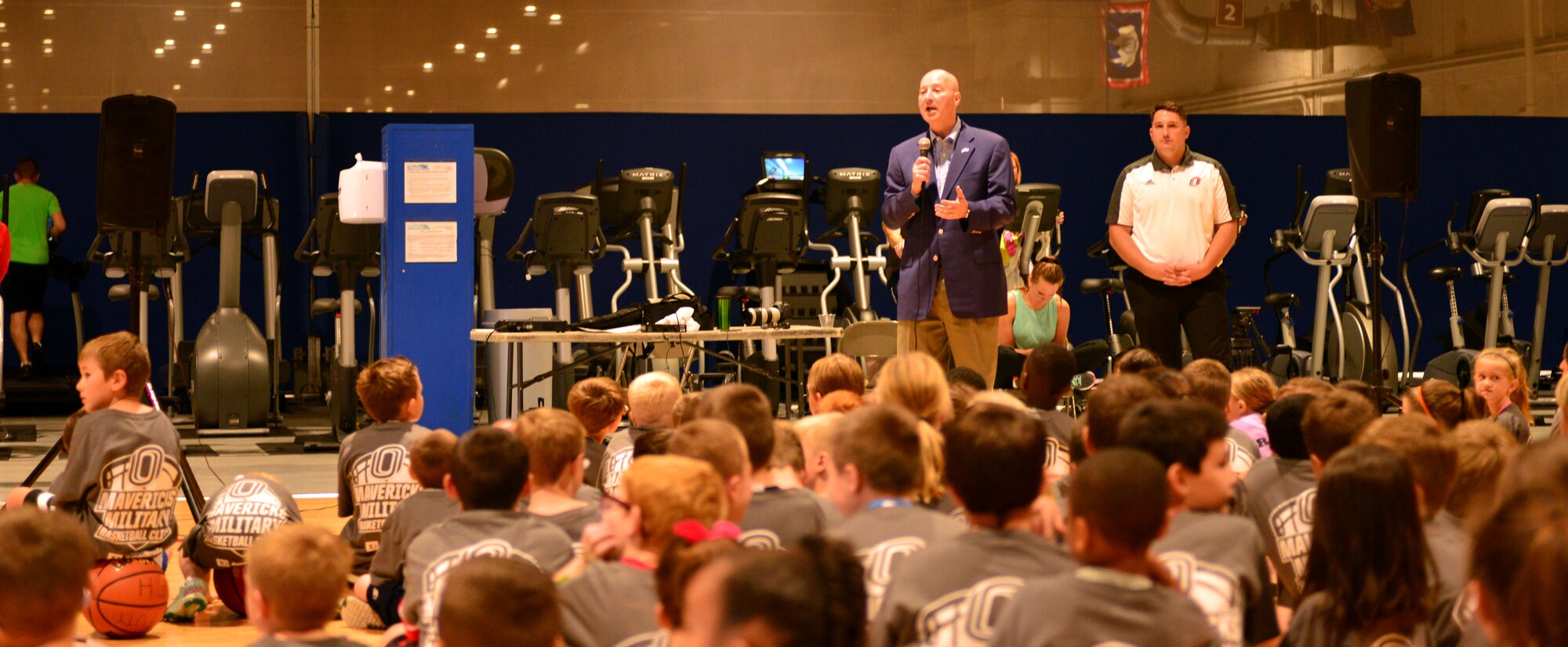 Nebraska Governor Pete Ricketts speaks to Team Offutt children Oct. 15, 2016 at the Offutt Field House. Governor Ricketts thanked the children and their families for everything they do to protect our freedom. The UNO Mavericks’ men’s and women’s basketball teams provided a free basketball clinic to more than 100 military-affiliated children. Nebraska Governor Pete Ricketts spoke to the campers and passed along thanks from the citizens of Nebraska to the members of Team Offutt.