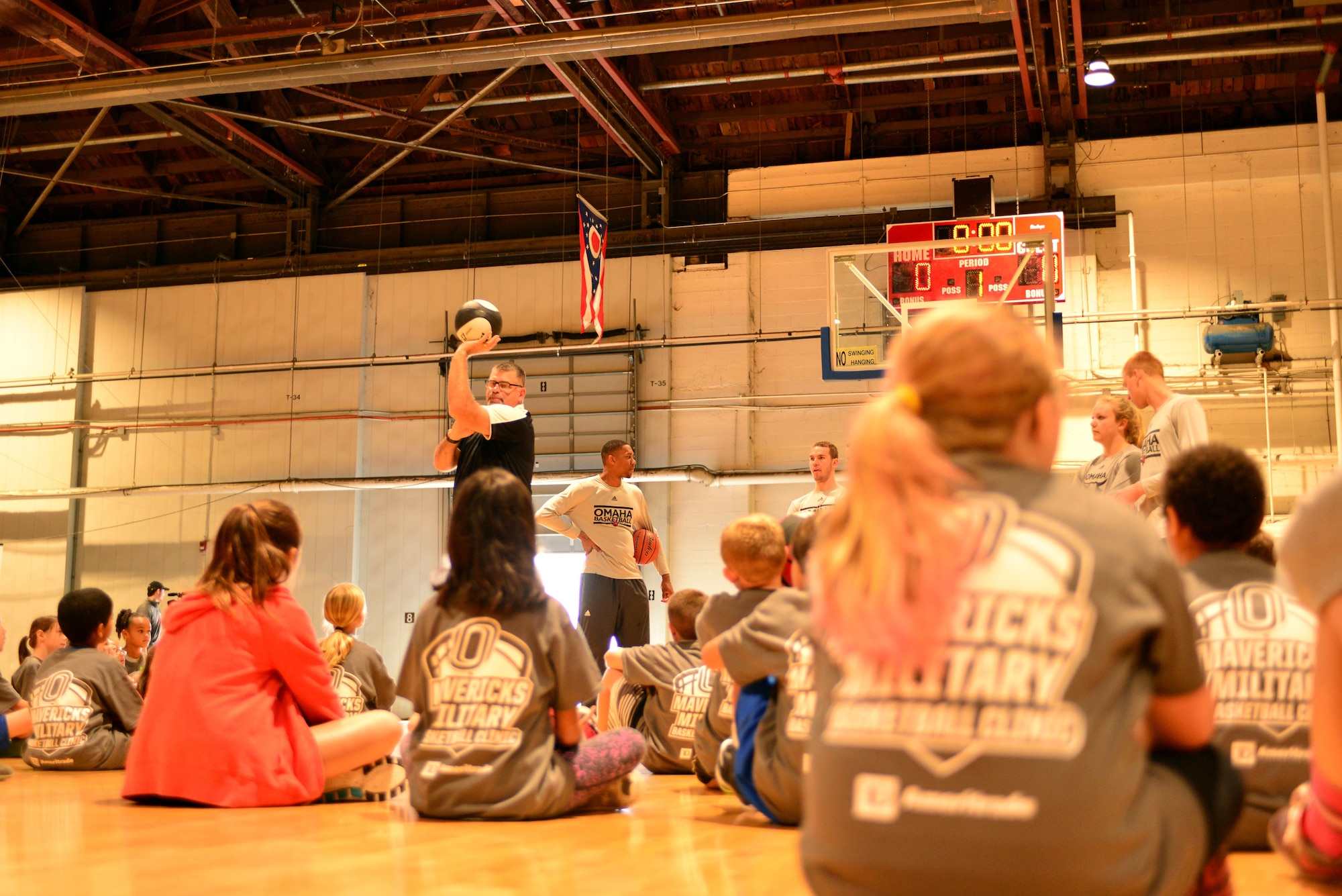 Campers receive shooting tips from University of Nebraska Omaha staff Oct. 15, 2016 at the Offutt Field House.  The UNO Mavericks’ men’s and women’s basketball teams provided a free basketball clinic to more than 100 military-affiliated children. Nebraska Governor Pete Ricketts spoke to the campers and passed along thanks from the citizens of Nebraska to the members of Team Offutt. 