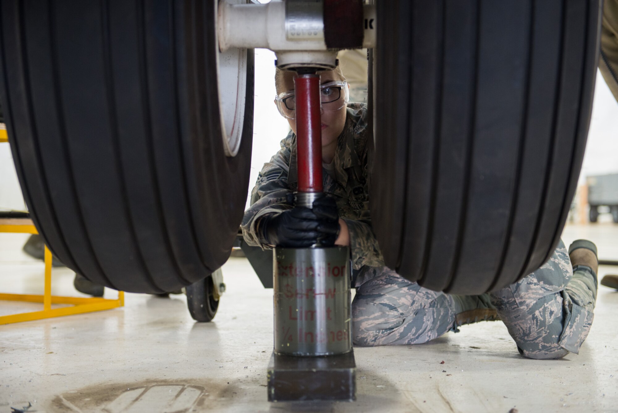 Senior Airman Sophia Jacobs, 934th Maintenance Squadron hydraulics shop, inspects a nose landing gear strut of a C-130 October 16. (U.S. Air Force photo by Tech. Sgt. Trevor Saylor)