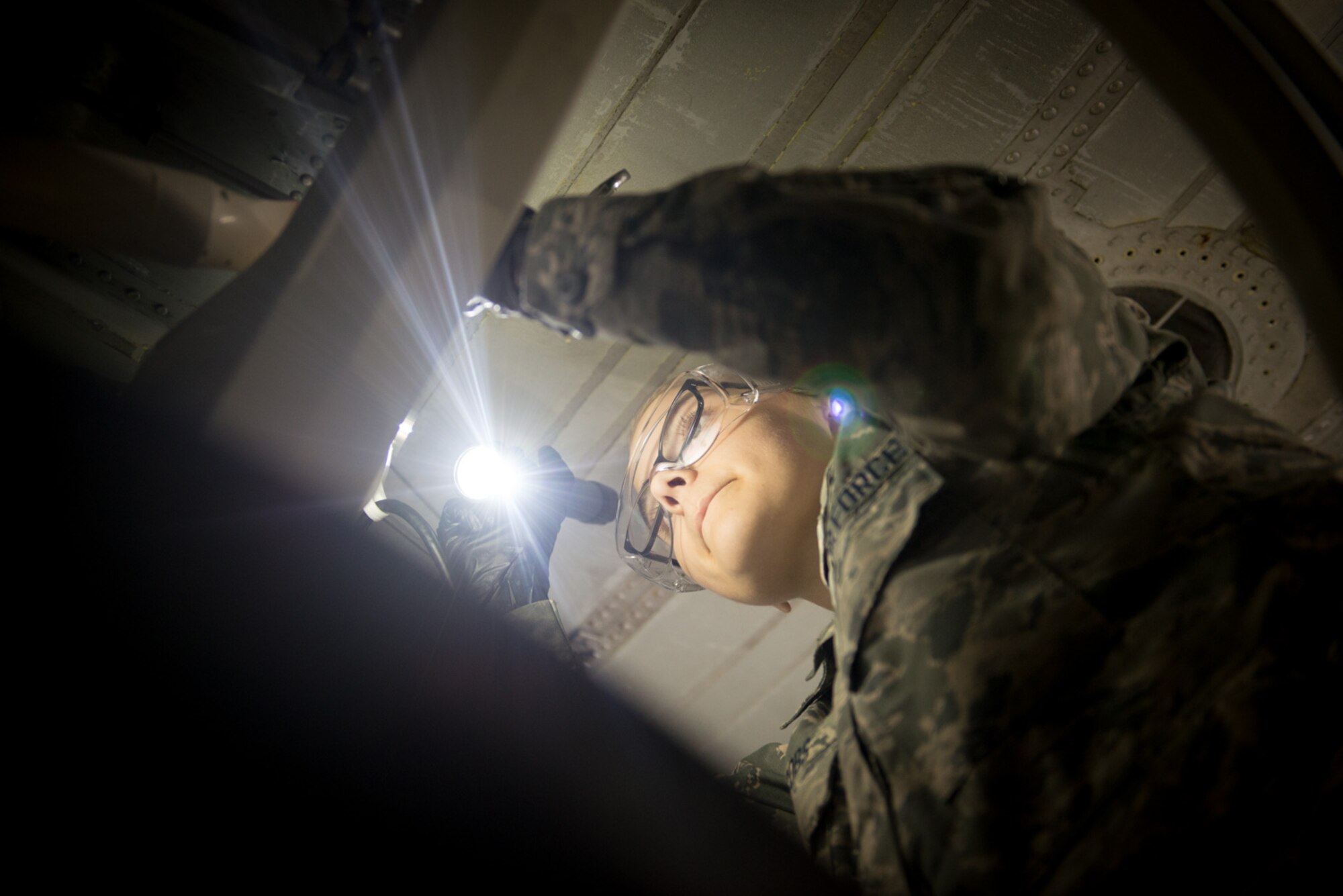 Senior Airman Sophia Jacobs, 934th Maintenance Squadron' hydraulics shop, inspects a nose landing gear strut of a C-130 October 16. (U.S. Air Force photo by Tech. Sgt. Trevor Saylor)