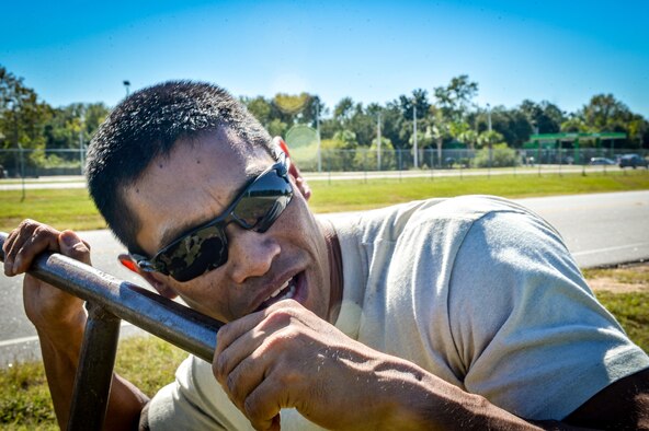 U.S. Air Force Staff Sgt. Clayton Bautista, 20th Civil Engineer Squadron water and fuels systems craftsman, listens as he turns on the service line to a newly repaired water pipe at Shaw Air Force Base, S.C., Oct. 13, 2016. The service line was shut off prior to the repair and was slowly turned back on to ensure the pipe held under the pressure and no leaks were present. (U.S. Air Force photo by Senior Airman Diana M. Cossaboom)