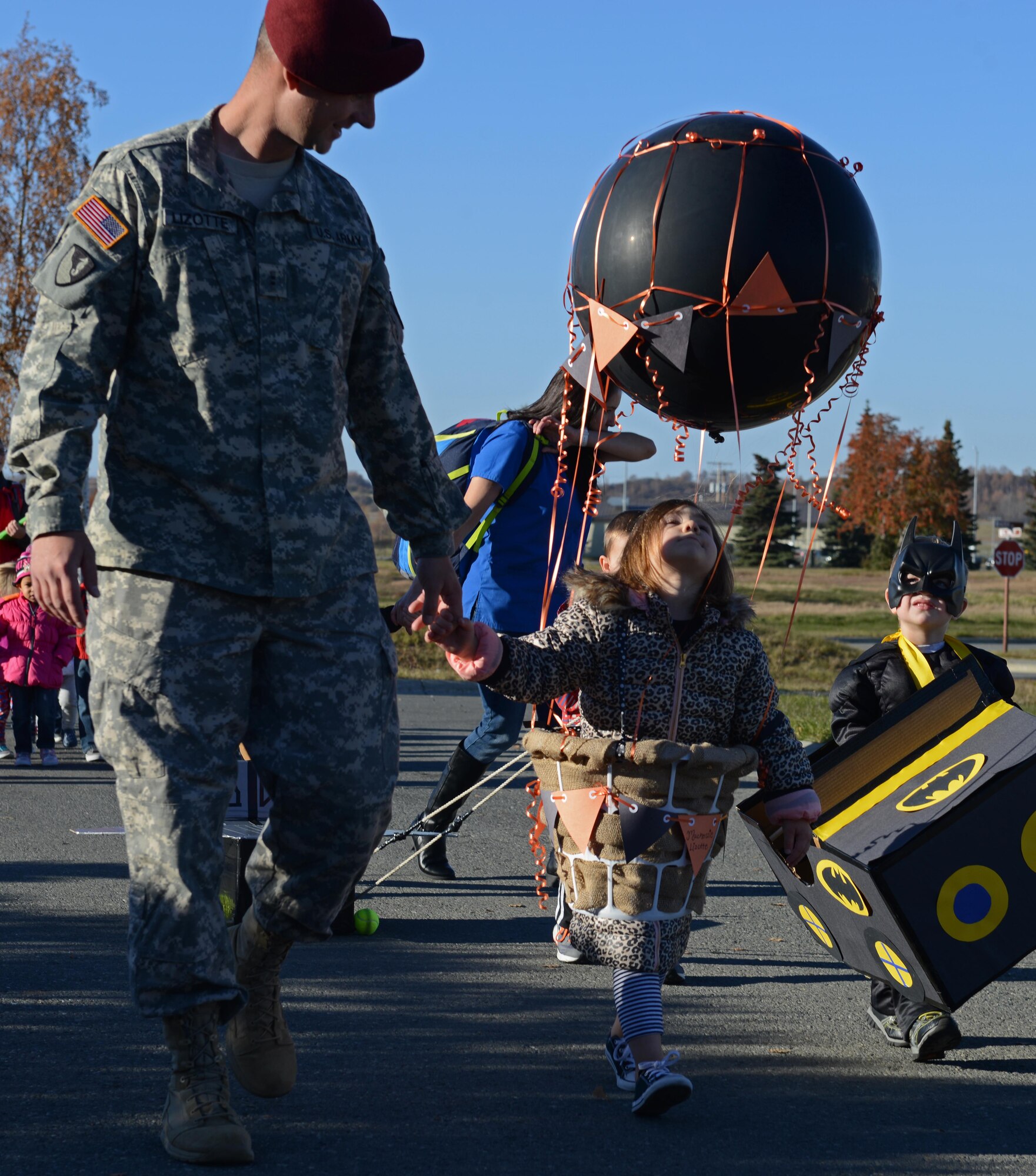 Participants of the Transportation Parade at Sitka Child Development Center float past spectators, at Joint Base Elmendorf-Richardson, Alaska, Oct. 14, 2016. October is transportation month at Sitka CDC. Floats in the parade highlight different types of transportation. All floats were built at home to encourage parental participation. 