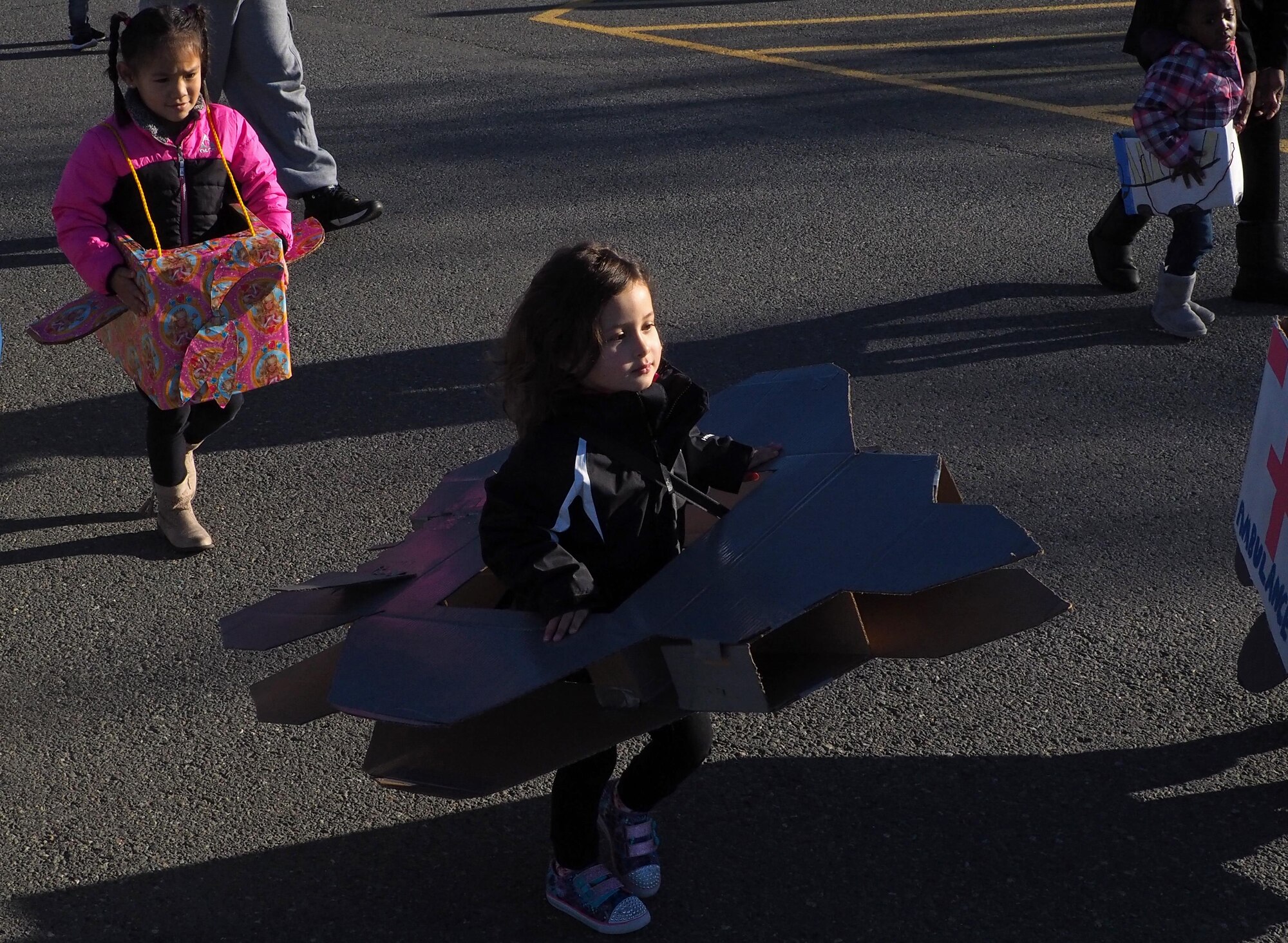 Aryanna Schwarz, 4, soars past during the Transportation Parade at the Sitka Child Development Center at Joint Base Elmendorf-Richardson, Alaska, Oct. 14, 2016. October is transportation month at Sitka CDC. Floats in the parade highlight different types of transportation. All floats were built at home to encourage parental participation. 