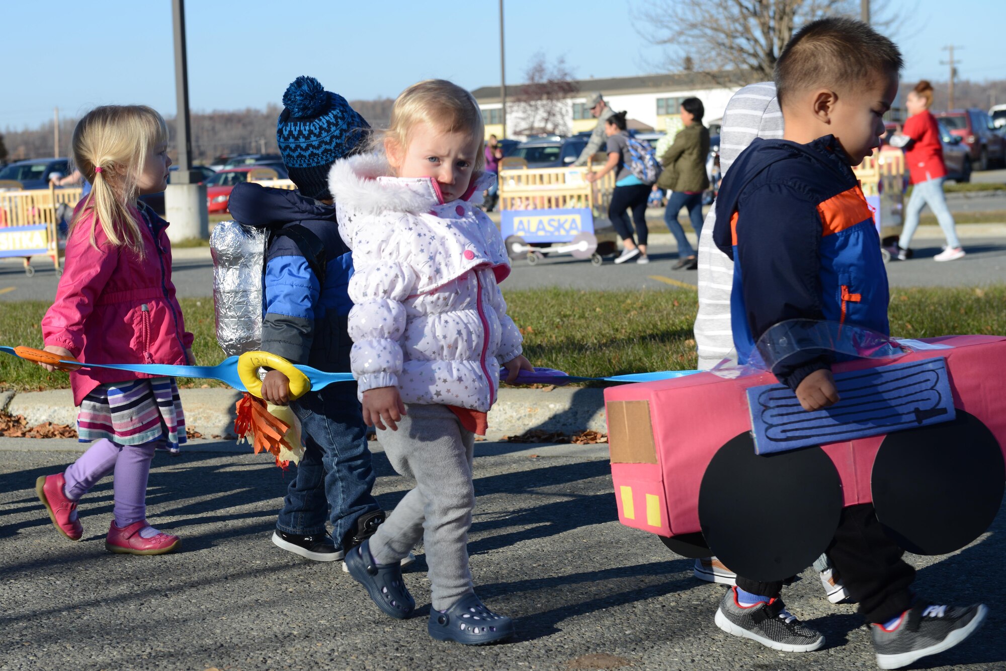 Children participate in the Transportation Parade at the Sitka Child Development Center parking lot at Joint Base Elmendorf-Richardson, Alaska, Oct. 14, 2016. October is transportation month at Sitka CDC. Floats in the parade highlight different types of transportation. All floats were built at home to encourage parental participation. 