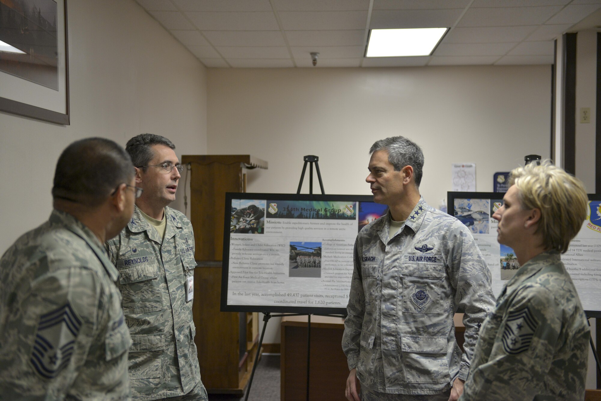 U.S. Air Force Col. William Reynolds, the 354th Medical Group commander, speaks with Lt. Gen. Ken Wilsbach, the 11th Air Force commander, Oct. 13, 2016, at Eielson Air Force Base, Alaska. Reynolds and Wilsbach spoke about how the environment impacts Airmen’s health and the importance of being mission ready at all times. (U.S. Air Force photo by Airman Isaac Johnson)