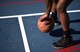 Airman 1st Class Daryl Parker, 608th Air Operations Center offensive duty technician, dribbles a basketball as part of his warm-up drills at Barksdale Air Force Base, La., Oct. 12, 2016. Parker started playing basketball at a young age and continues to maintain his physical fitness on the court. (U.S. Air Force photo/Senior Airman Damon Kasberg)