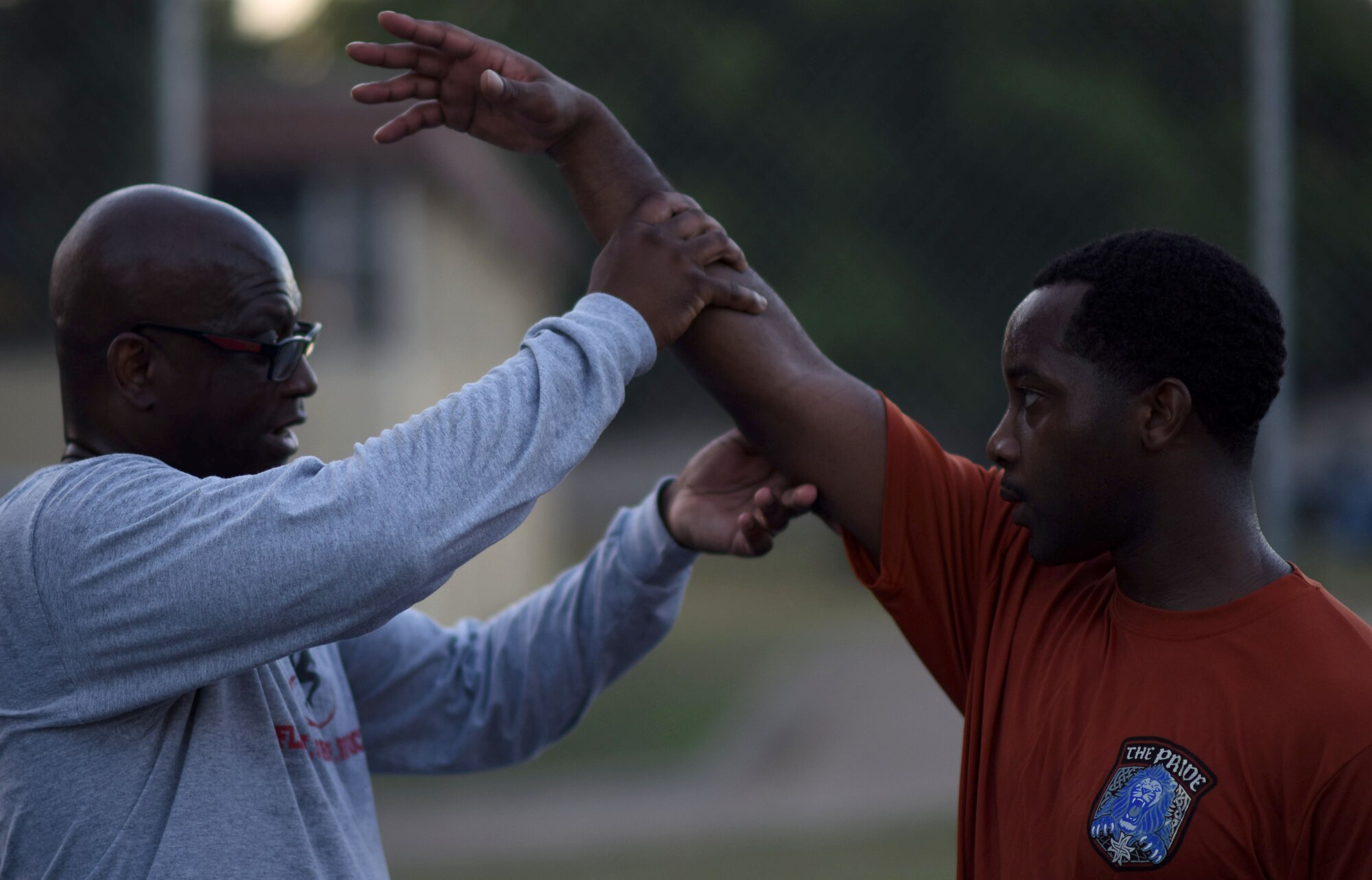 Retired Master Sgt. “E”, helps Airman 1st Class Daryl Parker, 608th Air Operations Center offensive duty technician, perfect his shooting form at Barksdale Air Force Base, La., Oct. 12, 2016. With support from his leadership, Parker was selected to try out for the All-Air Force Men’s Basketball Team. (U.S. Air Force photo/Senior Airman Damon Kasberg)