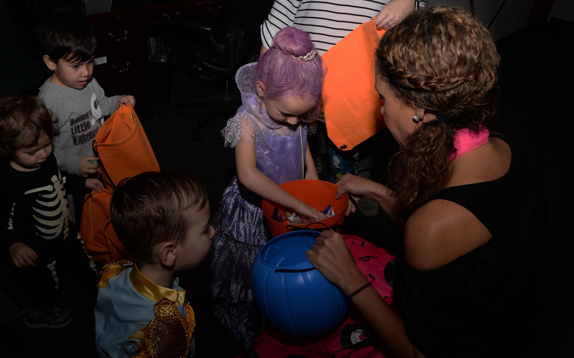 Travis youth ask for candy during the Annual Exceptional Family Member Program's Halloween Bash at Travis Air Force Base, Calif., Oct. 14, 2016. The event provided a safe atmosphere for special needs families to enjoy Halloween festivities. Approximately 100 people attended the event, which included trick-or-treating, pumpkin decorating, movies and games. (U.S. Air Force photo by Tech. Sgt. James Hodgman)