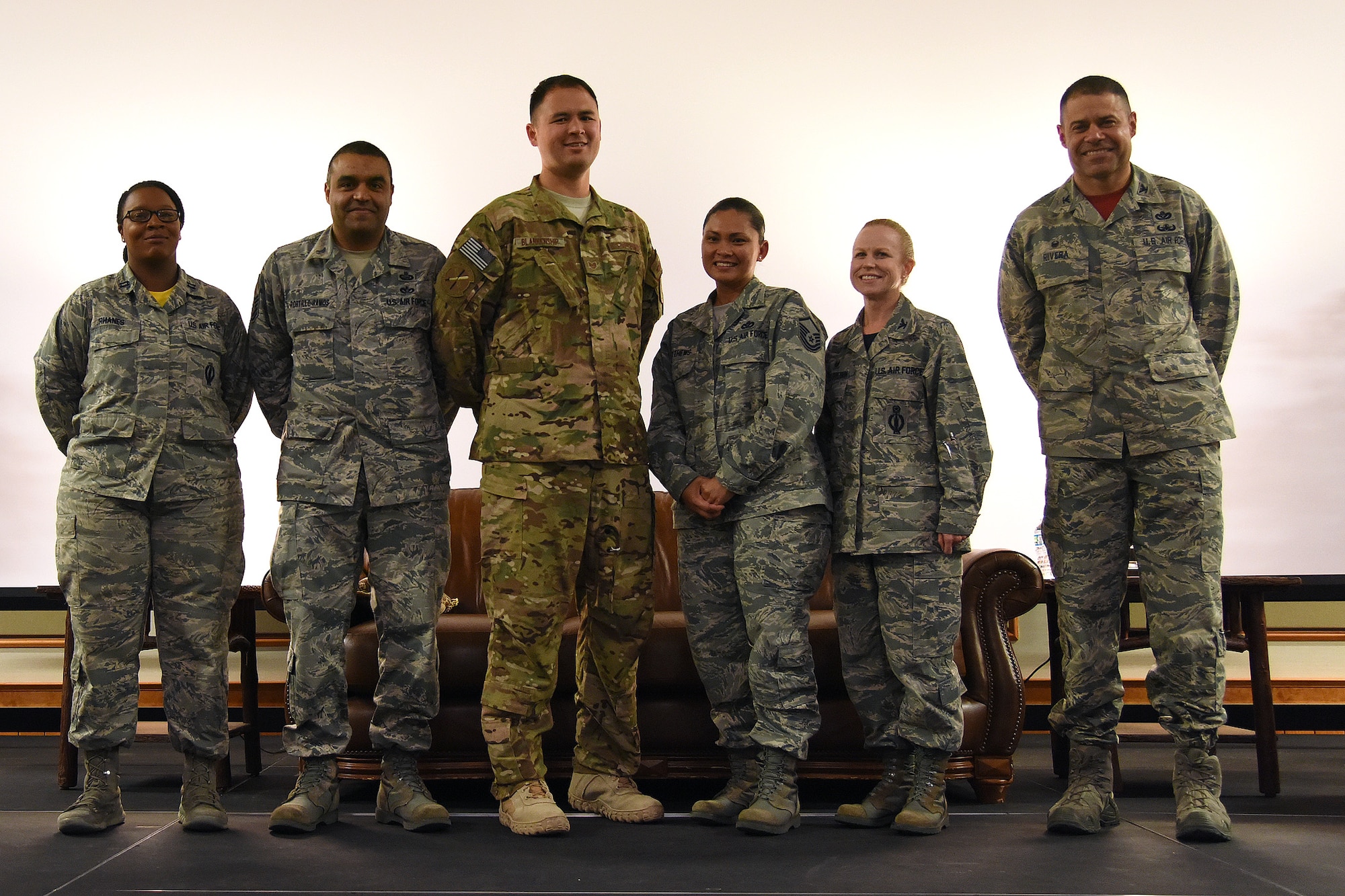 Speakers from a Storytellers event pose with Col. Anita Feugate Opperman, 341st Operations Group commander, Oct. 14, 2016, at Malmstrom Air Force Base, Mont. The speakers shared their about obstacles of battling vulvar cancer, almost getting kicked out of the military, having an affair, learning to live with thyroid cancer and undergoing 10 surgeries. (U.S. Air Force photo/Senior Airman Jaeda Tookes)

