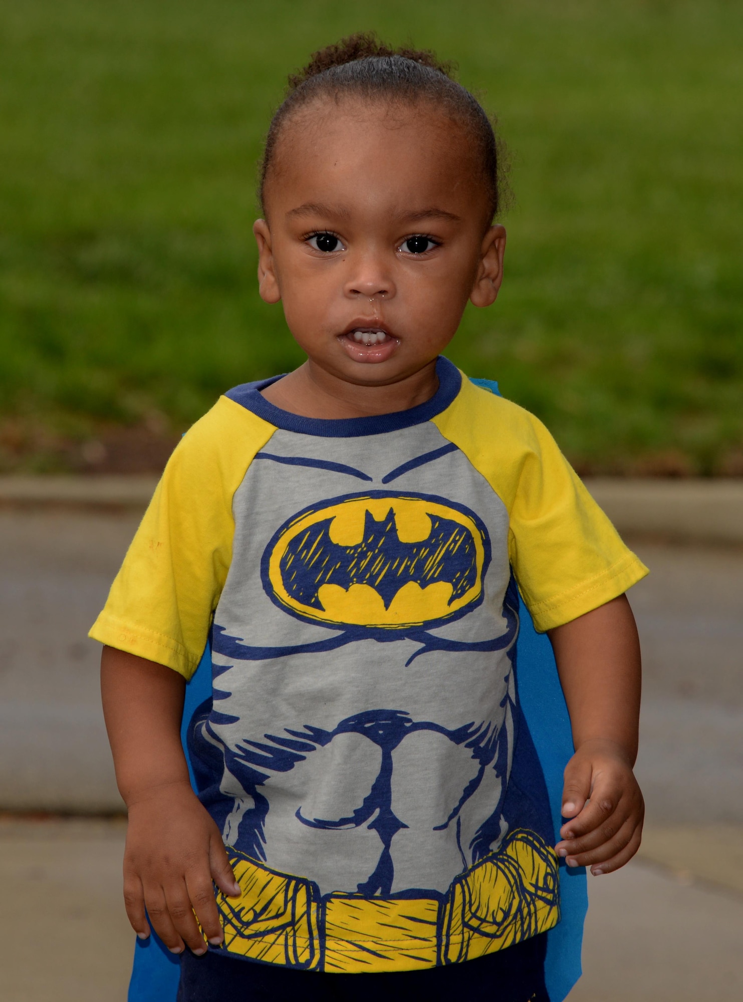 A young girl sporting a batgirl costume walks into the Airman and Family Readiness Center at Travis Air Force Base, Calif., Oct. 14, 2016 to attend the Annual Exceptional Family Member Program Halloween Bash. The event provided a safe atmosphere for special needs families to enjoy Halloween festivities. Approximately 100 people attended the event, which included trick-or-treating, pumpkin decorating, movies and games. (U.S. Air Force photo by Tech. Sgt. James Hodgman)