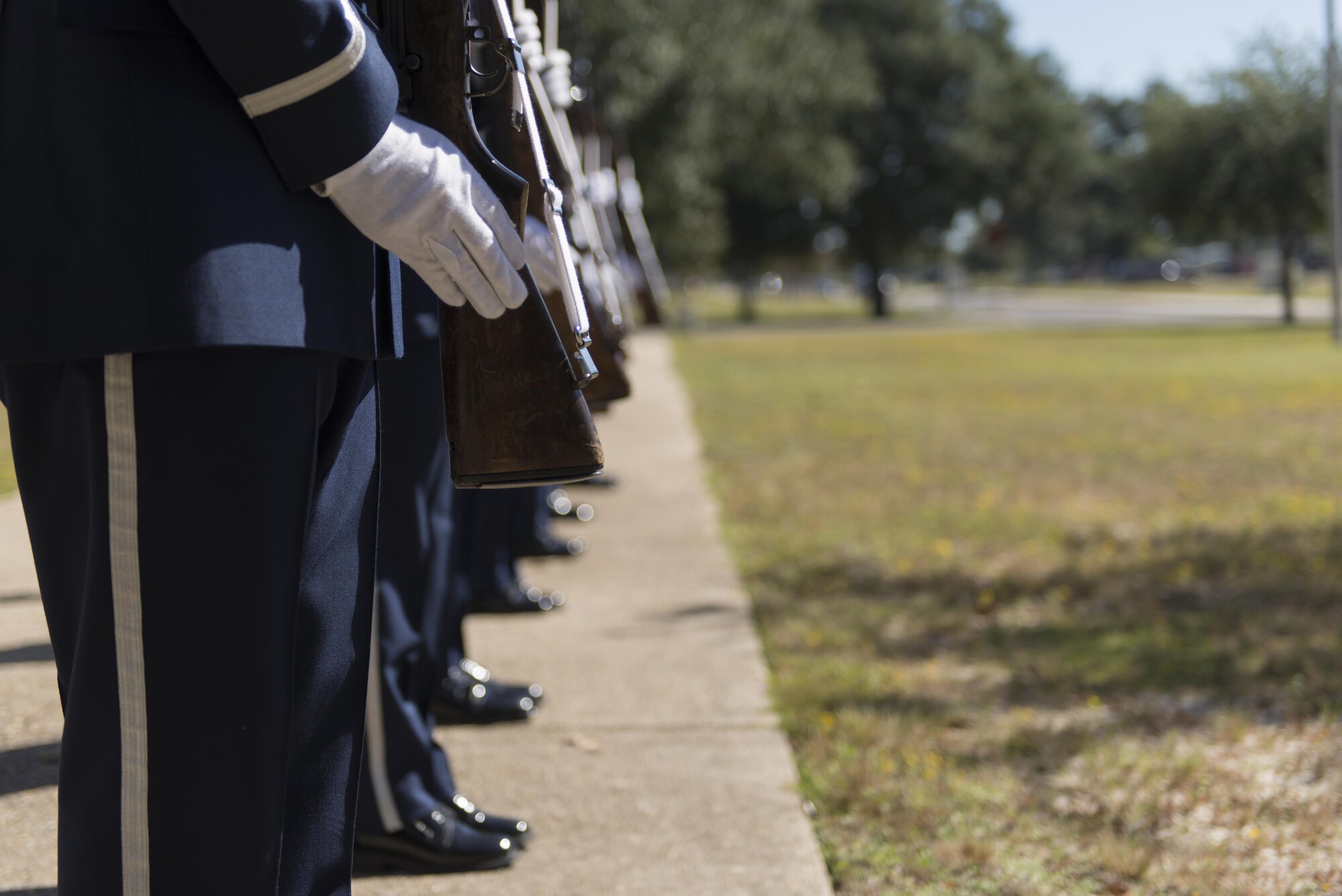 Keesler Honor Guard firing party members render military honors during a mock active duty funeral Oct. 12, 2016, on Keesler Air Force Base, Miss. Keesler Honor Guard members were trained on the proper wear of the ceremonial uniform, firing party, presentation of the colors and pallbearer duties during an eight day course with the Air Force Honor Guard Mobile Training Team. The team ended the training with a mock active duty funeral and graduation ceremony. (U.S. Air Force photo by Andre’ Askew/Released)
