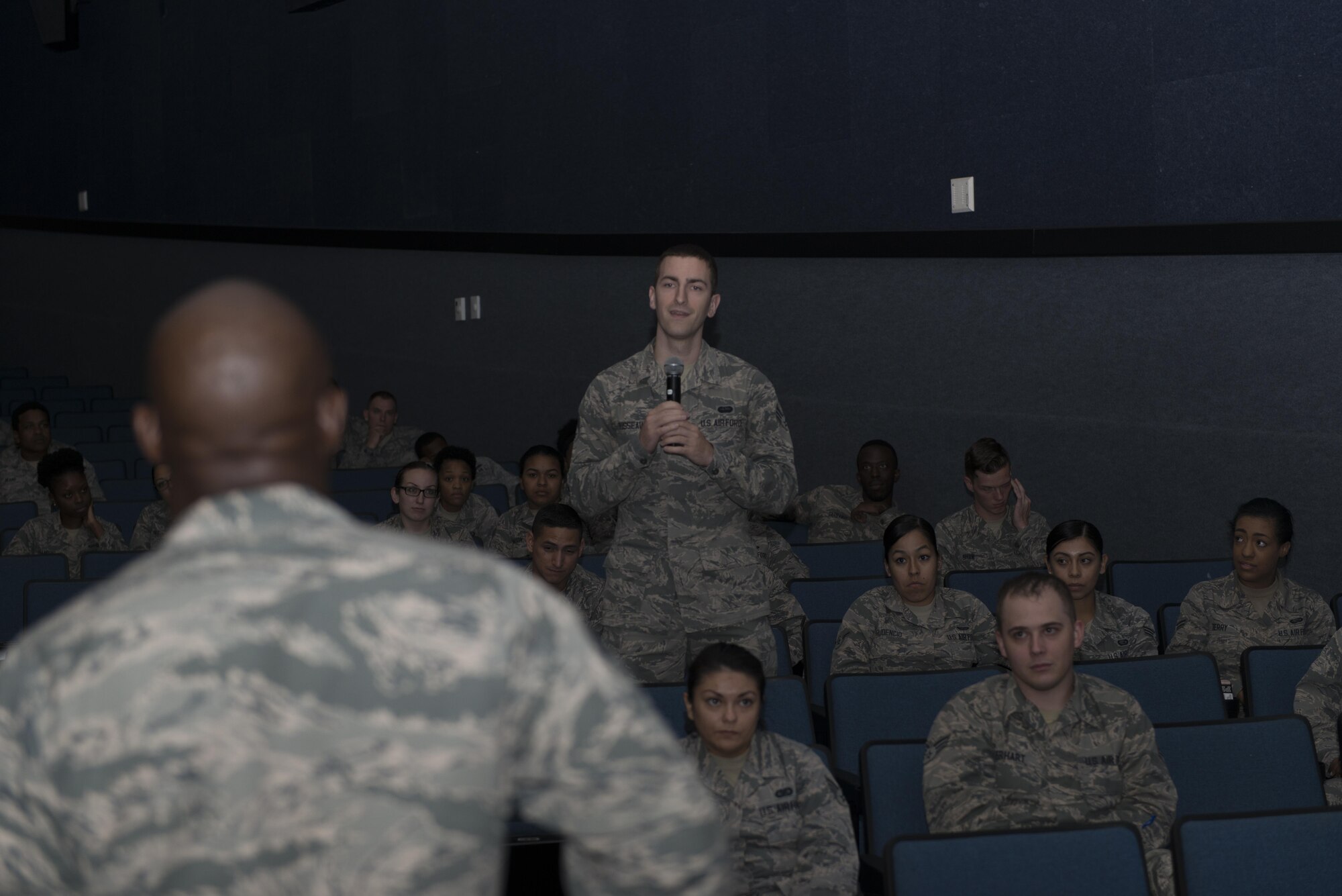 Senior Airman Albert Dusseault, 81st Communications Squadron base content manager, asks Chief Master Sgt. Vegas Clark, 81st Training Wing command chief, a question during an enlisted call at the Welch Theater Oct 12, 2016, on Keesler Air Force Base, Miss. During the enlisted call, Clark discussed his expectations, the commander’s vision, the future of Airmen’s careers and various topics around the base. (U.S. Air Force photo by Andre’ Askew/Released)