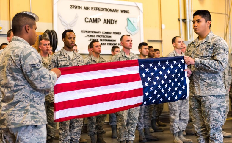 Airmen, assigned to the 366th Civil Engineer Squadron, fold a flag at the annual remembrance ceremony of Master Sgt. Evander Andrews at Mountain Home Air Force Base, Idaho. Andrews was the first casualty in the War on Terror after the attacks on 9/11 when he lost his life while building a runway in Qatar.