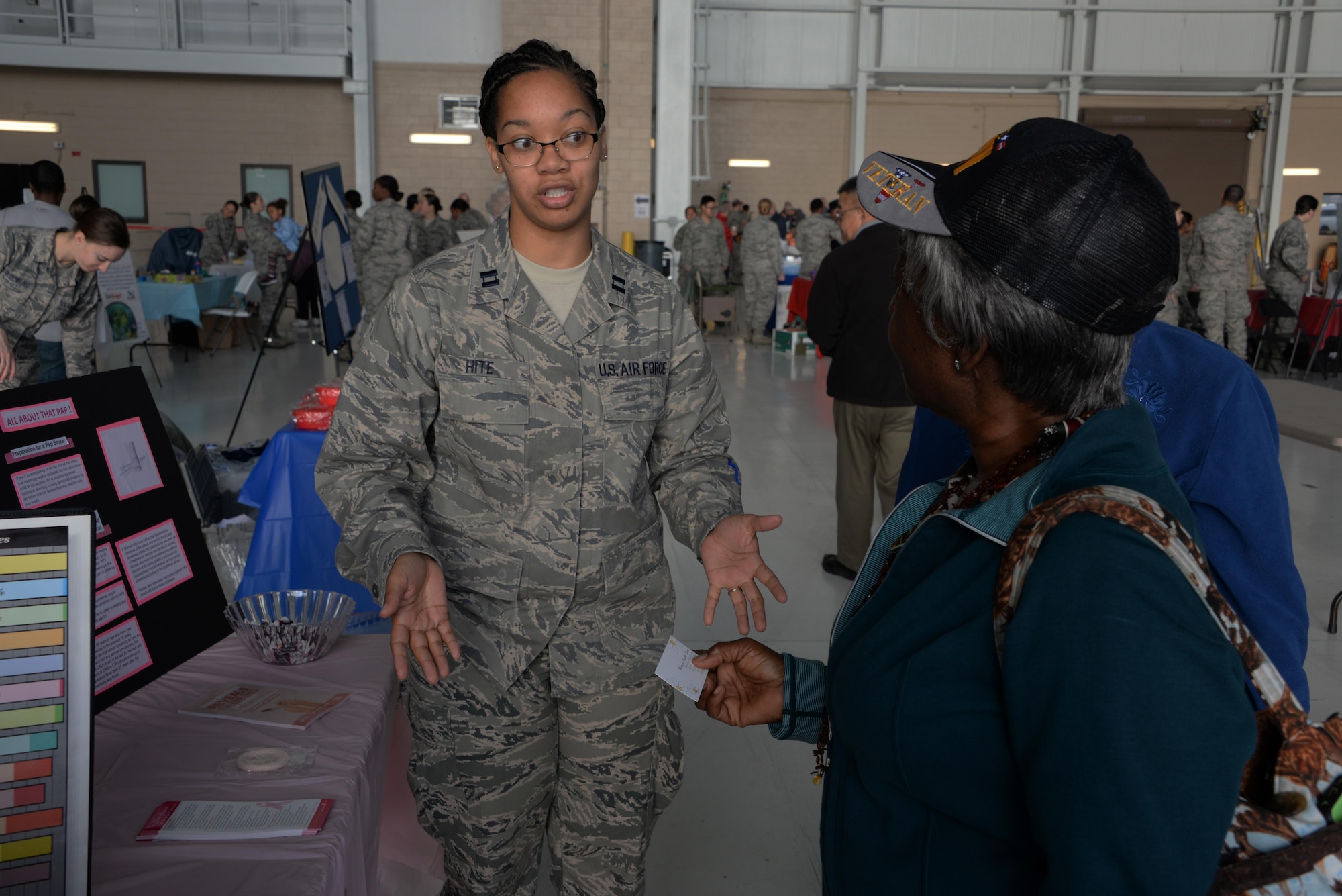 Capt. Angela Hite, 60th Surgical Operations Squadron women's health nurse practitioner, speaks with Retired U.S. Army Capt. Patricia Fly, during the 21st annual Retiree Appreciation Day event at Travis Air Force Base, Calif., Oct. 15, 2016. Nearly 40 organizations provided information to more than 100 military veterans and their families during the event, which was held to honor the service of retired servicemembers. (U.S. Air Force photo by Tech. Sgt. James Hodgman)