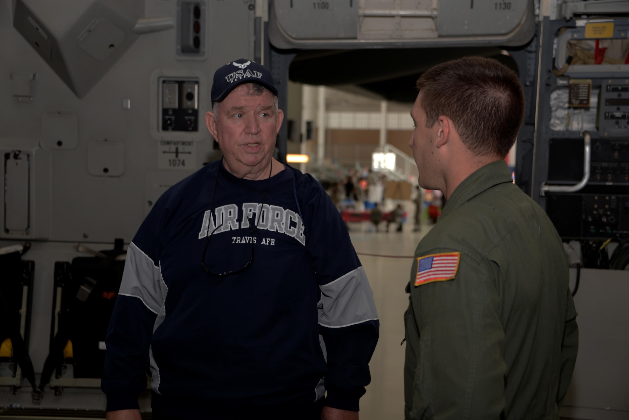 Retired Air Force Tech. Sgt. David Brodsky from Norristown, Pennsylvania, speaks with Senior Airman Joshua Doucet, 21st Airlift Squadron, during a tour of a C-17 Globemaster III at the 21st annual Retiree Appreciation Day event at Travis Air Force Base, Calif., Oct. 15, 2016. The event was held to honor the service and sacrifice of military veterans. Over 100 retired servicemembers attended. (U.S. Air Force photo by Tech. Sgt. James Hodgman)
