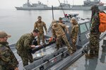 Participants in Clear Horizon (CH16) store the MK 18 MOD 1 Unmanned Underwater Vehicle (UUV) after it completed it's mission in Chinhae, Korea on Oct. 16, 2016. CH16 is a live-action exercise which enhances cooperation and improves capabilities in mine countermeasures operations, with  participating nations including Republic of Korea Navy, United States, Australia, Canada, New Zealand, Philippines, Thailand, and the United Kingdom. (U.S. Navy Combat Camera Photo by Petty Officer 2nd Class Daniel Rolston)