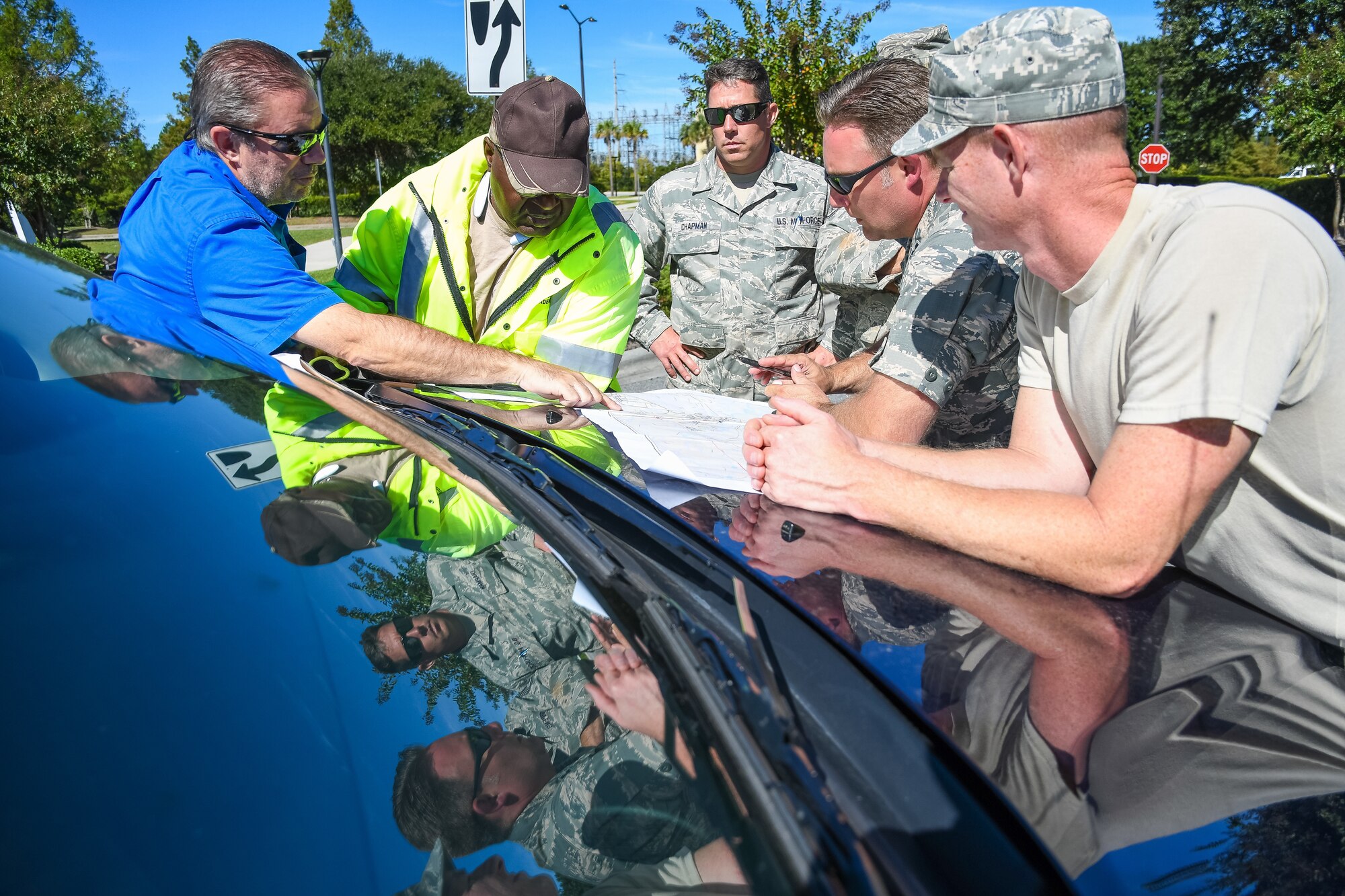 Citizen Airmen from the 116th Air Control Wing, Georgia Air National Guard, meet with supervisors from the Chatham County Public Works to plan road-clearing operations for the day during cleanup in the aftermath of Hurricane Matthew, Savannah, Ga., Oct. 10, 2016. The Airmen deployed to Savannah to support civil authorities working along side the Chatham County Public Works department to assist in road clearing and debris cleanup operations. (U.S. Air National Guard photo by Senior Master Sgt. Roger Parsons)