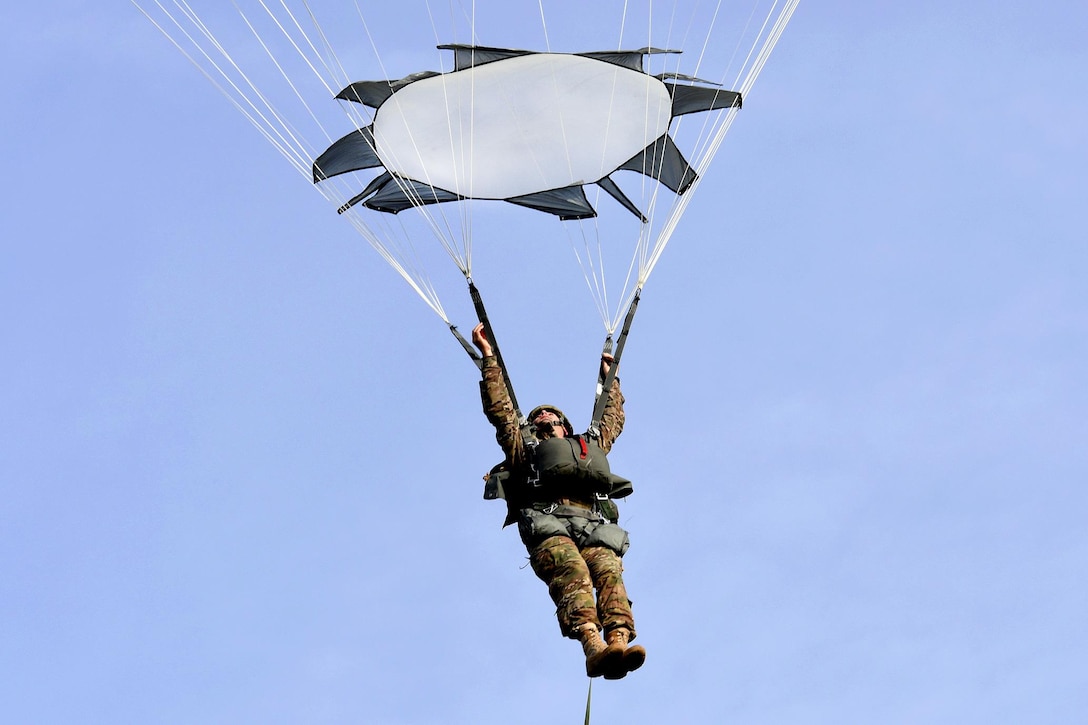 A U.S. paratrooper prepares to land during the Peacemaster Unity airborne exercise in Pordenone, Italy, Oct. 17, 2016. Army photo by Staff Sgt. Opal Vaughn 