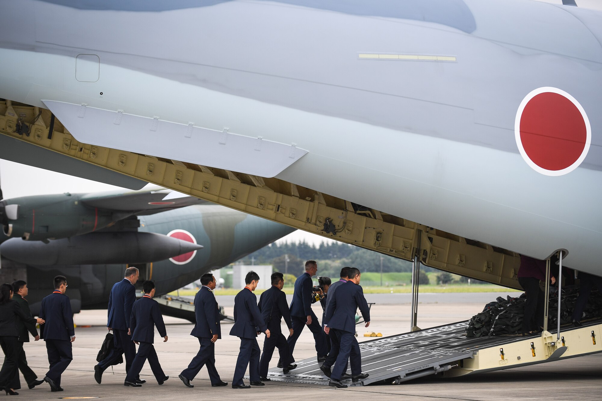 Participants of the Air Force Forum Japan enter a Japan Air Self-Defense Force XC-2 cargo plane for a familiarization flight at Iruma Air Base, Japan, Oct. 13, 2016. The plane has recently been added to the JASDF’s fleet of aircraft and the flight allowed them to showcase their new capabilities. (U.S. Air Force photo by Staff Sgt. Michael Smith)