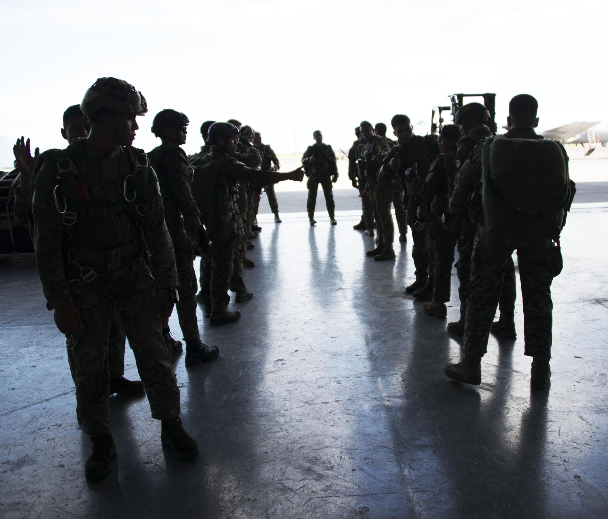 Members from Operational Detachment Alpha (ODA) 1324 and Philippine Army Light Reaction Regiment (LRR) prepare for high-altitude, low-opening (HALO) airdrops from a MC-130H Combat Talon II at Clark Air Base, Sept. 24. The 1st Special Forces Group Airborne is responsible for providing Special Forces operators to the Pacific Command (PACOM) area of responsibility. (U.S. Air Force photo by Capt. Jessica Tait)