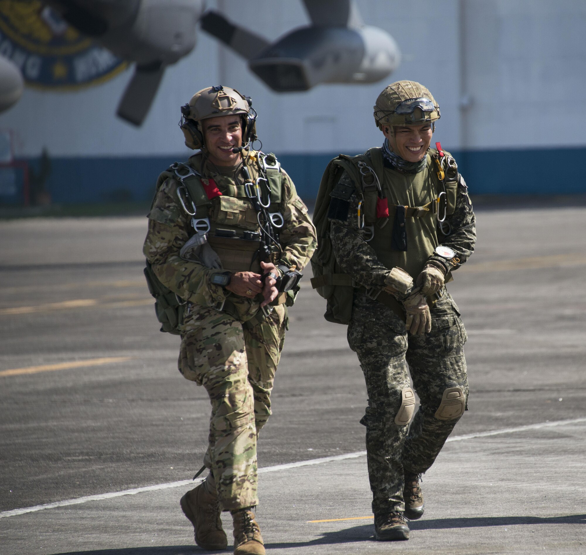 A member from Operational Detachment Alpha (ODA) 1324 and Philippine Army Light Reaction Regiment (LRR) walk the flightline in preparation for high-altitude, low-opening (HALO) airdrops from a MC-130H Combat Talon II at Clark Air Base, Sept. 24. The Armed Forces Philippine (AFP) typically jump from Philippine Air Force rotary wing assets, so jumping from a MC-130H provided a unique experience for the LLR. (U.S. Air Force photo by Capt. Jessica Tait)