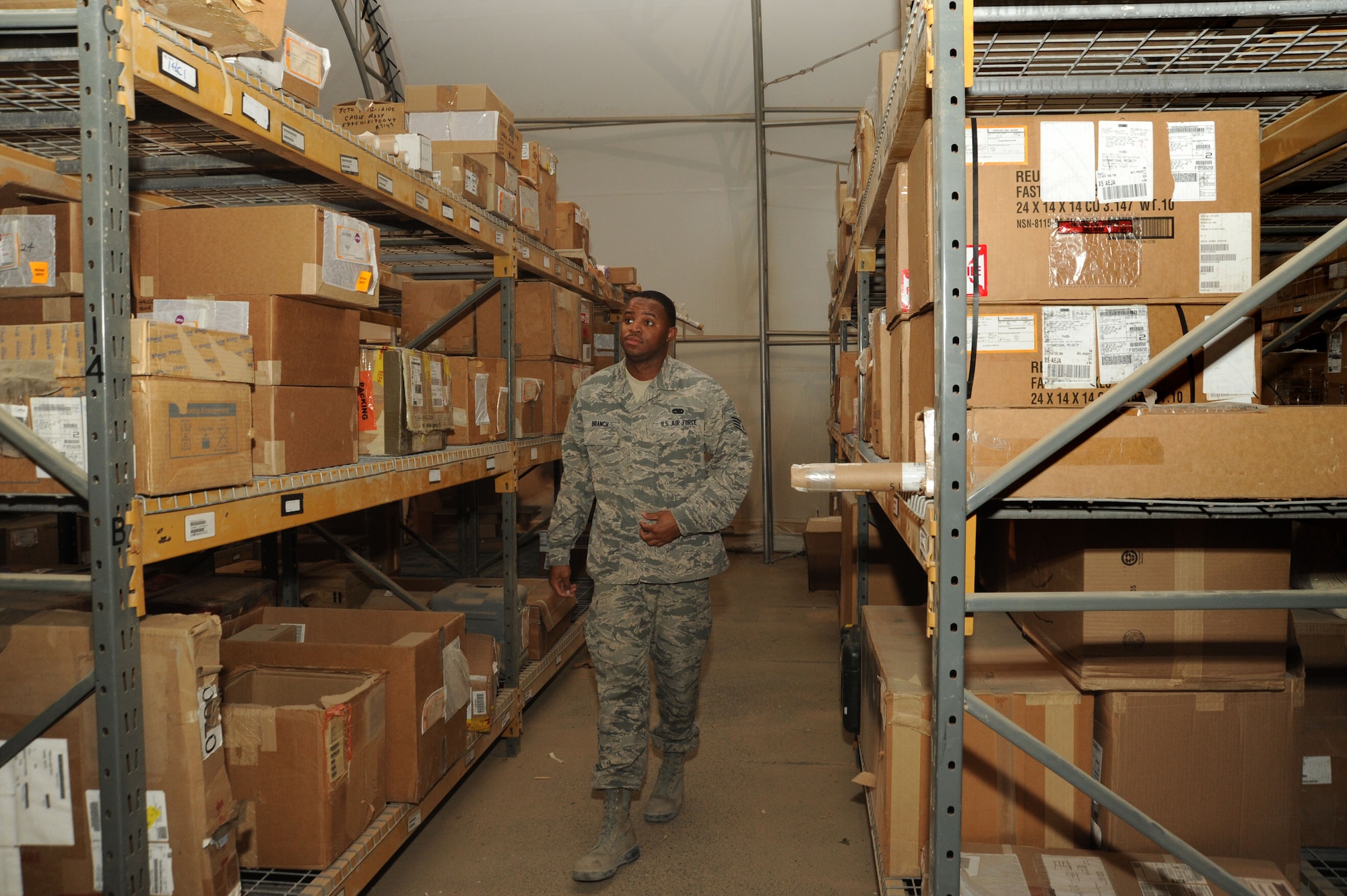 Staff Sgt. Terrance Branch, 386th Expeditionary Logistics Readiness Squadron materiel management journeyman, looks for a part in the aircraft parts store warehouse Oct. 13, 2016 at an undisclosed location in Southwest Asia. Branch is a member of the APS team that is responsible for storing and issuing parts for nine weapon systems within their shops responsibility. (U.S. Air Force photo/Senior Airman Zachary Kee)