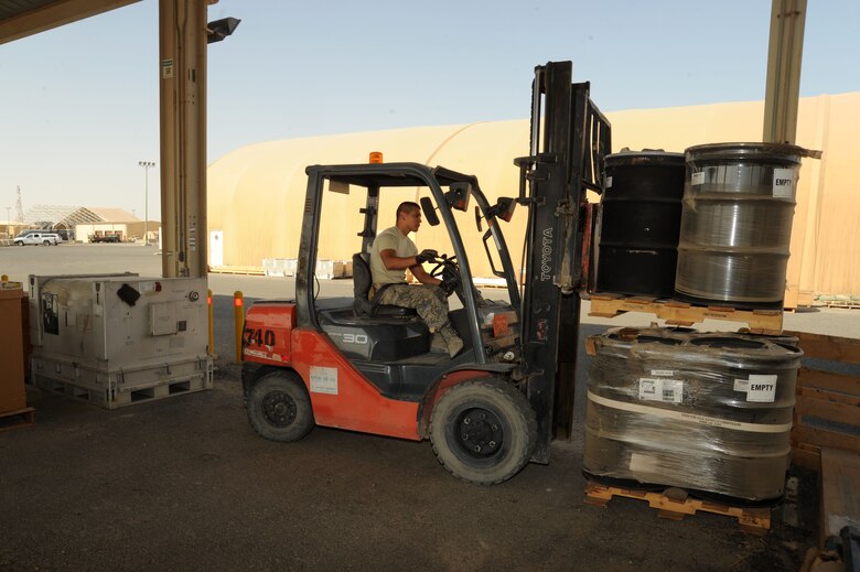 Senior Airman Nicholas Contreras, 386th Expeditionary Logistics Readiness Squadron materiel management journeyman, moves a pallet of barrels to make space in the aircraft parts store facility Oct. 13, 2016. The APS plays a vital role in mission accomplishment for flying units within the area of responsibility and directly supports Operation Inherent Resolve. (U.S. Air Force photo/Senior Airman Zachary Kee)