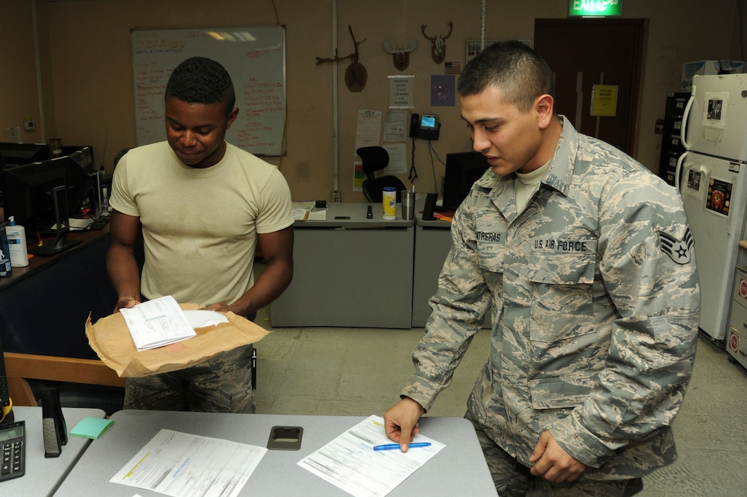 Senior Airman Nicholas Contreras, left, 386th Expeditionary Logistics Readiness Squadron materiel management journeyman, and Senior Airman Dominique Corbin, 386 ELRS traffic management journeyman, prepare an aircraft part for shipment Oct. 13, 2016 at an undisclosed location in Southwest Asia. The aircraft parts store coordinates with TMO to send needed parts to locations throughout the area of responsibility. (U.S. Air Force photo/Senior Airman Zachary Kee)