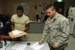 Senior Airman Nicholas Contreras, left, 386th Expeditionary Logistics Readiness Squadron materiel management journeyman, and Senior Airman Dominique Corbin, 386 ELRS traffic management journeyman, prepare an aircraft part for shipment Oct. 13, 2016 at an undisclosed location in Southwest Asia. The aircraft parts store coordinates with TMO to send needed parts to locations throughout the area of responsibility. (U.S. Air Force photo/Senior Airman Zachary Kee)