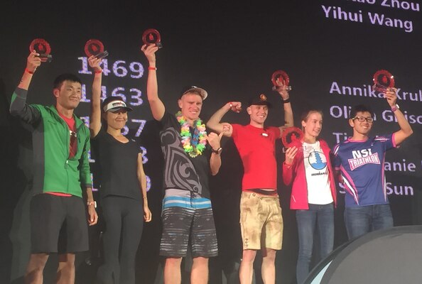 1st Lt. Johannes Olind (third from left) holds up a trophy for placing 3rd in the Mens 25-29 year old division at the Ironman triathlon in Hefei, China Oct. 16.