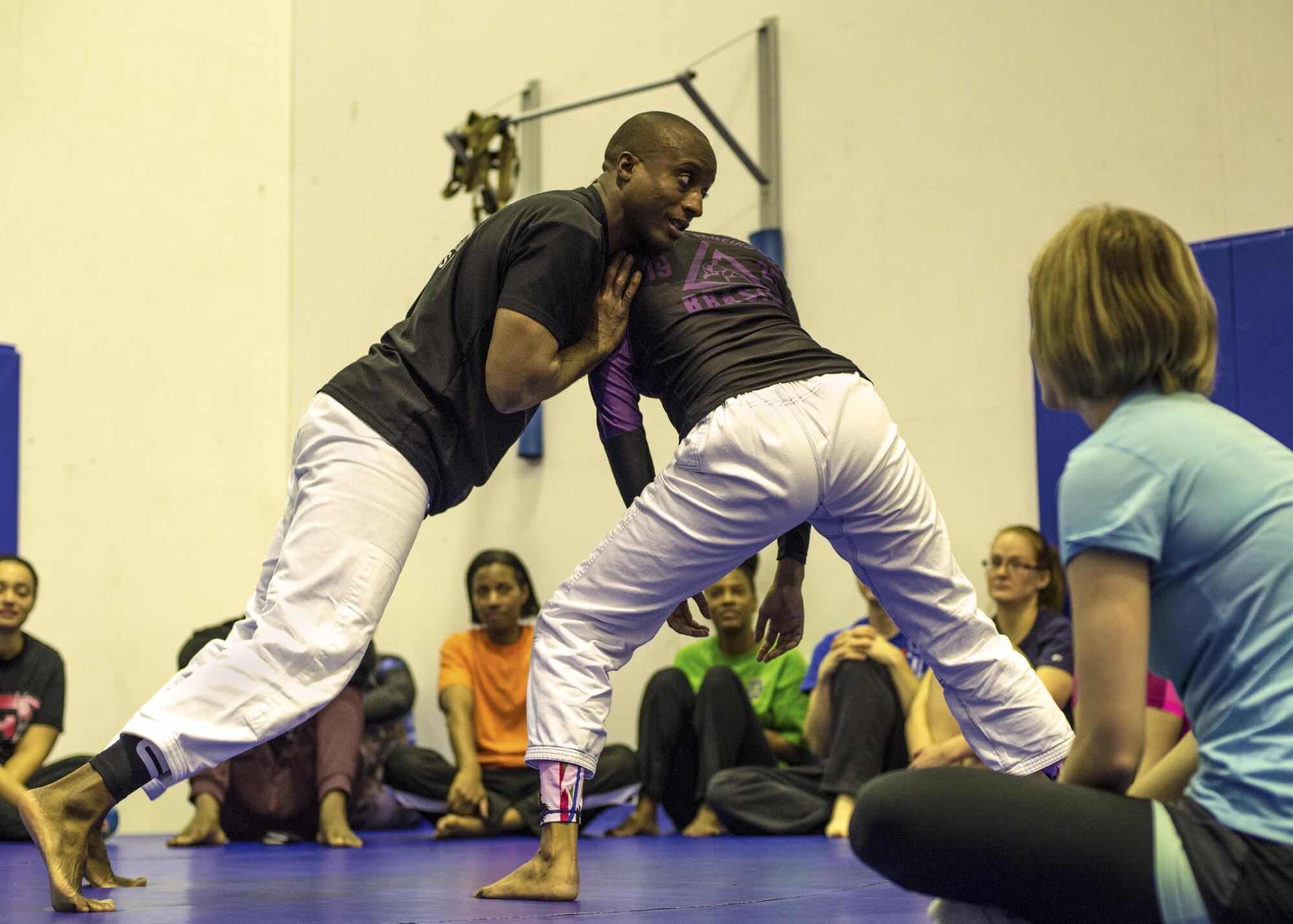 Students practice self-defense positions with each other during a Gracie Jiu-Jitsu class held at the Samurai Fitness Center 15 Oct. 2016 at Yokota Air Base, Japan. The free self-defense class is offered for anyone, no experience is necessary. (U.S. Air Force photo by Airman 1st Class Donald Hudson/Released)