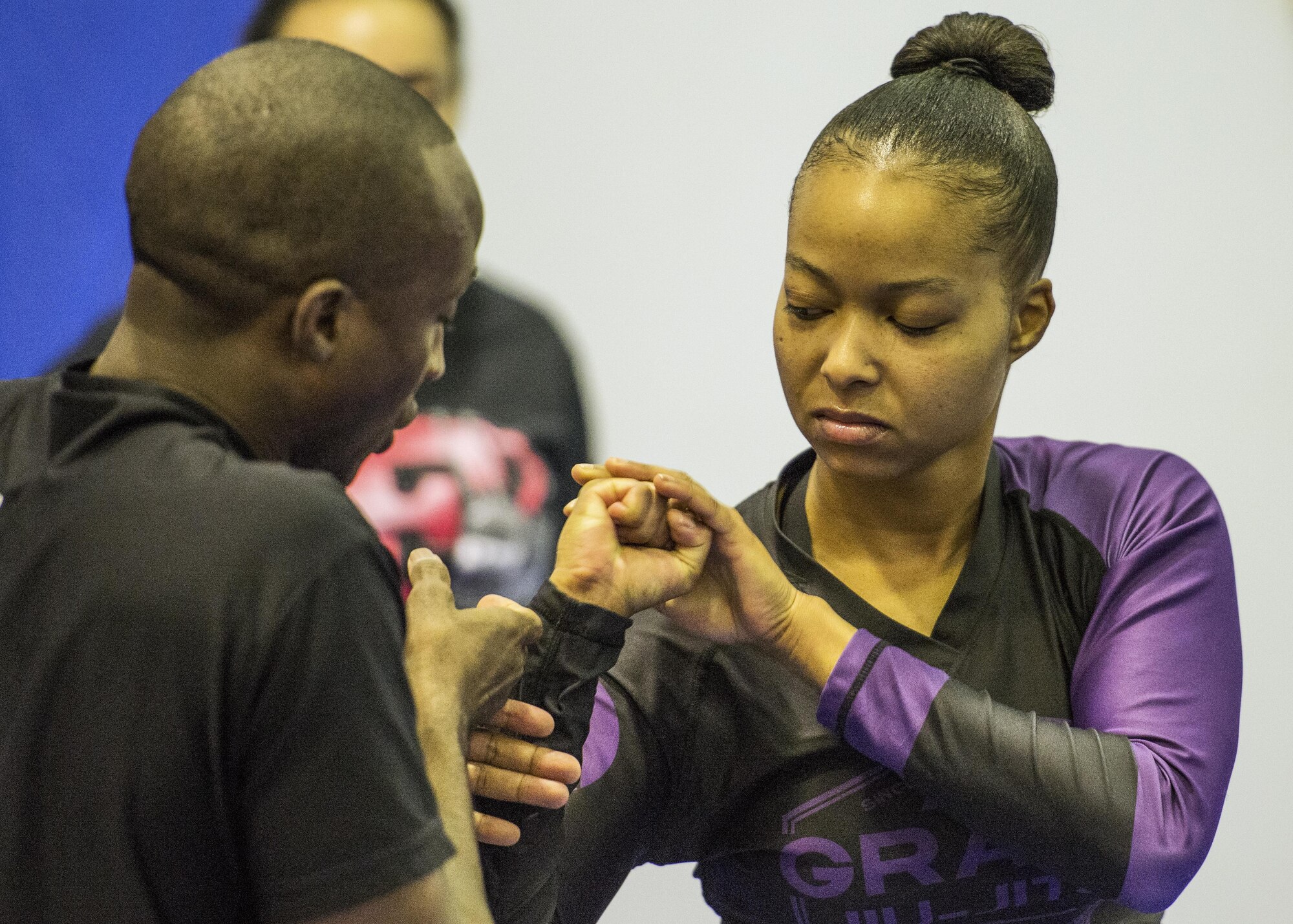Gracie Jiu-Jitsu instructors demonstrate how to break free of an attackers grasp during a sexual assault prevention class at the Samurai Fitness Center 15 Oct. 2016 at Yokota Air Base, Japan. The class is to improve students’ knowledge of sexual assault and teaches them how to become a harder target for predators. (U.S. Air Force photo by Airman 1st Class Donald Hudson/Released)