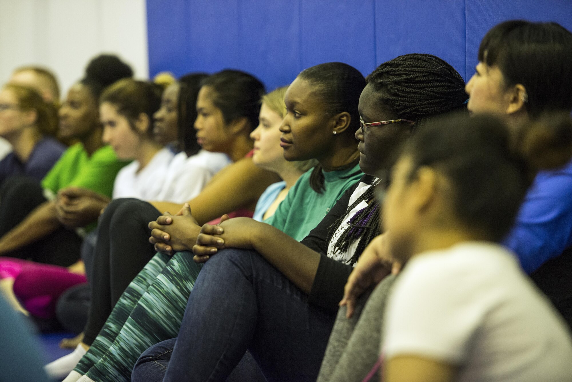 Students listen to self-defense instructor during a sexual assault prevention class at the Samurai Fitness Center 15 Oct. 2016 at Yokota Air Base, Japan. The class is to improve students’ knowledge of sexual assault and teaches them how to become a harder target for predators. (U.S. Air Force photo by Airman 1st Class Donald Hudson/Released)