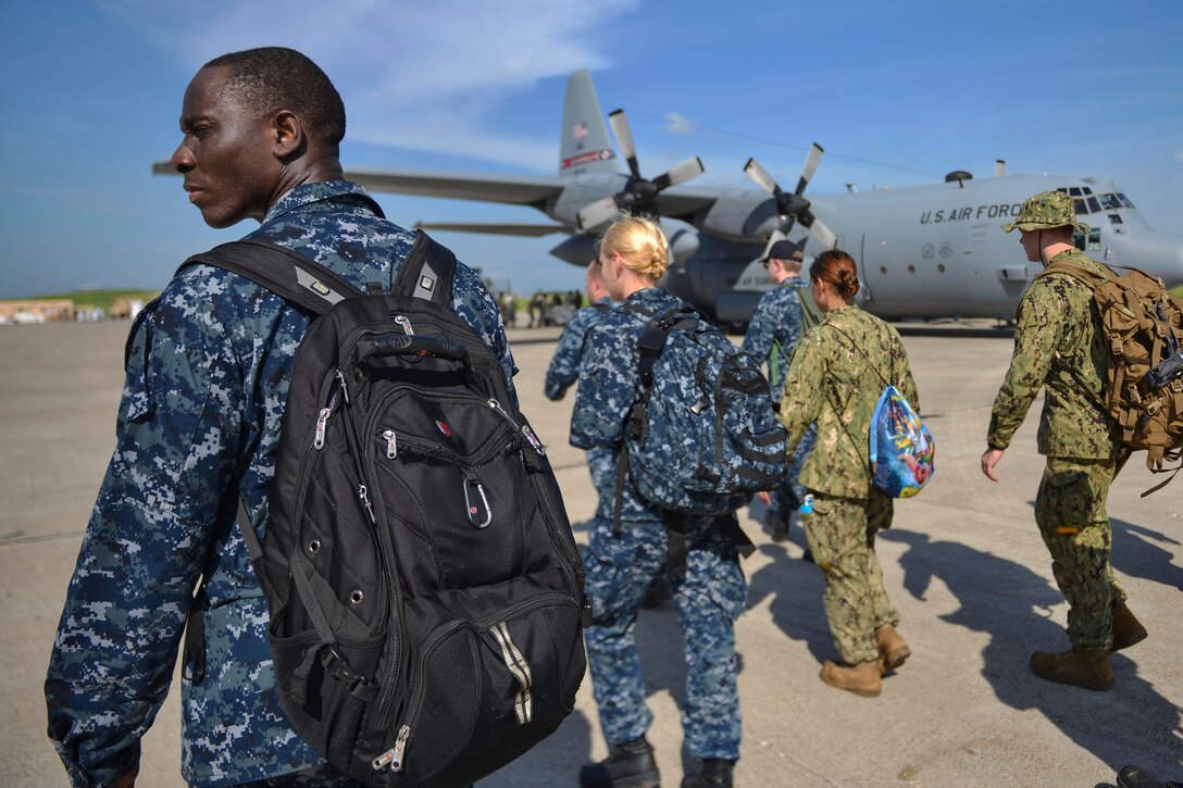 Service members attached to Joint Task Force Matthew prepare to load supplies for aid delivery in Port-au-Prince, Haiti, Oct. 17, 2016. JTF Matthew is providing humanitarian aid and disaster relief to Haiti following Hurricane Matthew. Navy photo by Petty Officer 2nd Class Andrew Murray