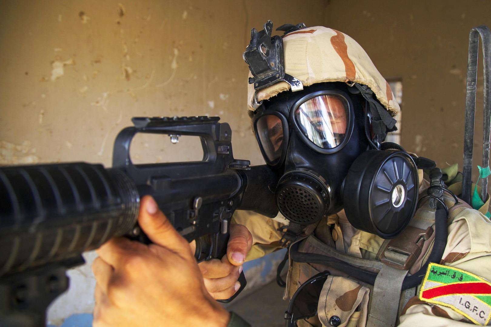 An Iraqi soldier attending the advanced infantry course provides security during chemical, biological, radiological and nuclear defense training at Camp Taji, Iraq, Oct. 9, 2016. This training helps Iraqi soldiers understand and defend against CBRN threats. This training is critical to enabling ISF to counter Islamic State of Iraq and the Levant as they work to regain territory from the terrorist group and support Combined Joint Task Force - Operation Inherent Resolve's building partner capacity mission. (U.S. Army photo by Spc. Craig Jensen)