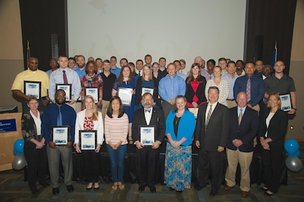 Naval Surface Warfare Center Dahlgren Division (NSWCDD) employees honored at the command's 2016 academic awards ceremony are pictured after the event where they were commended for successfully taking on the challenges of balancing work and family responsibilities with academics to obtain certifications or degrees. In addition to core engineering disciplines – mechanical, electrical and systems engineering – this year's graduates earned degrees in areas such as aerospace engineering, cybersecurity, national security and strategic studies, contract management, operations research, applied physics, and biochemistry. 