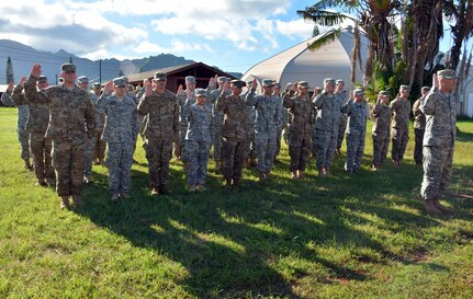 U.S. Army reservists with the 414th Military Police Company headquartered in Joplin, Mo., raise their right hands and recite the law enforcement officer oath after completing their law enforcement integration and certification training provided by U.S. Army MP Soldiers from the 728th MP Battalion, 8th MP Brigade, 8th Theater Sustainment Command, Sept. 4-28 at Schofield Barracks, Hawaii. (U.S. Army photo by Staff Sgt. Taresha Hill, 8th Military Police Brigade Public Affairs, 8th Theater Sustainment Command)