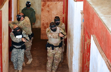 U.S. Army reservists with the 414th Military Police Company headquartered in Joplin, Mo., participate in an active shooter training exercise as part of the company’s law enforcement integration and certification training provided by U.S. Army MP Soldiers from the 728th MP Battalion, 8th MP Brigade, 8th Theater Sustainment Command, Sept. 4-28 at Schofield Barracks, Hawaii. (U.S. Army photo by Staff Sgt. Taresha Hill, 8th Military Police Brigade Public Affairs, 8th Theater Sustainment Command)