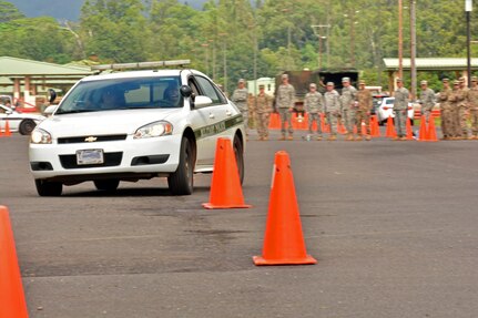 U.S. Army reservists with the 414th Military Police Company headquartered in Joplin, Mo., navigate a driving course as part of the company’s law enforcement integration and certification training provided by U.S. Army MP Soldiers from the 728th MP Battalion, 8th MP Brigade, 8th Theater Sustainment Command, Sept. 4-28 at Schofield Barracks, Hawaii. (U.S. Army photo by Staff Sgt. Taresha Hill, 8th Military Police Brigade Public Affairs, 8th Theater Sustainment Command)