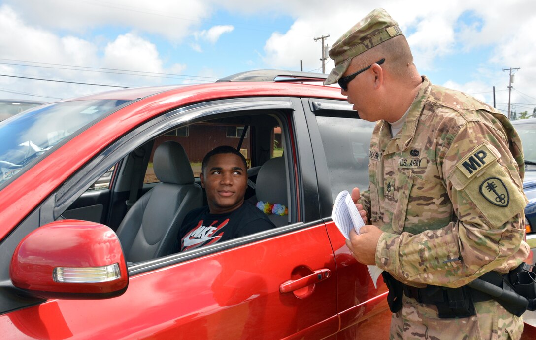 U.S. Army reservist Staff Sgt. Sanford Du Brul from the 414th Military Police Company headquartered in Joplin, Mo., responds to a notional traffic accident as part of the company’s law enforcement integration and certification training provided by U.S. Army MP Soldiers from the 728th MP Battalion, 8th MP Brigade, 8th Theater Sustainment Command, Sept. 4-28 at Schofield Barracks, Hawaii. (U.S. Army photo by Staff Sgt. Taresha Hill, 8th Military Police Brigade Public Affairs, 8th Theater Sustainment Command)