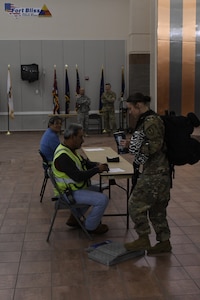 A Soldier assigned to the 785th MP Bn., is weighed at the Silas L. Copeland Arrival/Departure Airfield Control Group here Oct. 3.