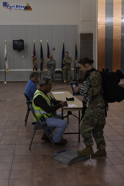A Soldier assigned to the 785th MP Bn., is weighed at the Silas L. Copeland Arrival/Departure Airfield Control Group here Oct. 3.